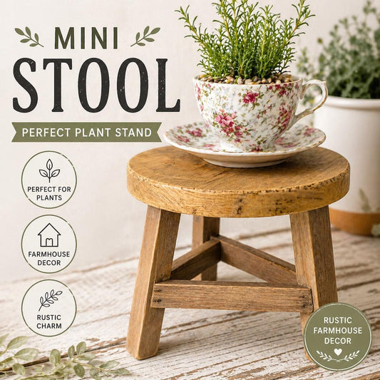 Mini rustic wood stool used as a plant stand, holding a floral teacup planted with greenery